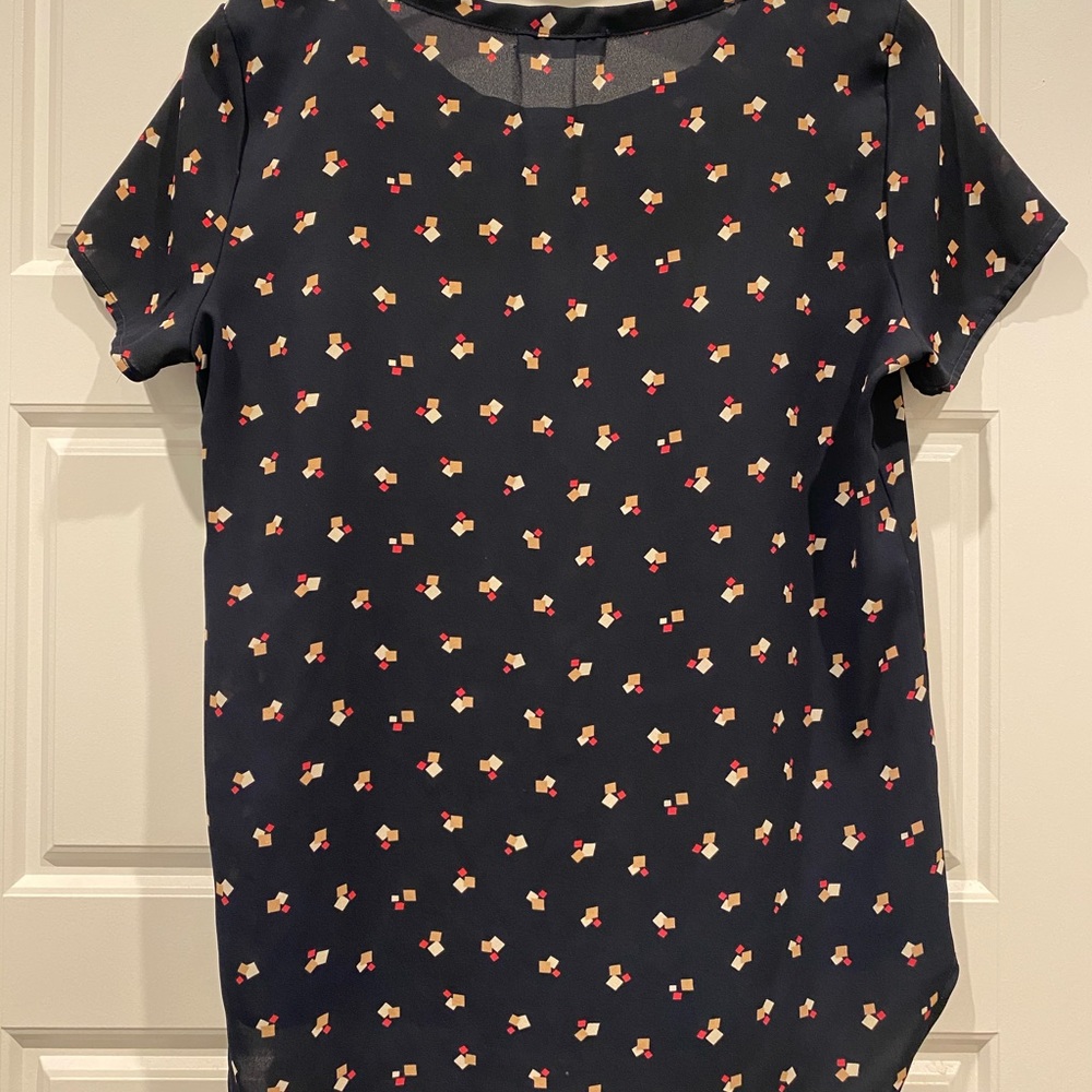 Geometric patterned blouse with pocket detail